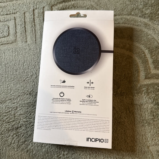 Incipio 15W wireless charging pad packaging showing product features and lifetime warranty on back of box