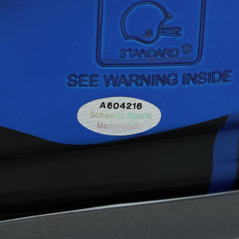 Schwartz Sports Memorabilia COA sticker with certification number A604216 on blue football helmet surface