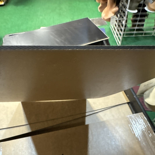 Black acrylic sheet 12x24 inches with 1/8 inch thickness shown with smooth edges and reflective surface angle view