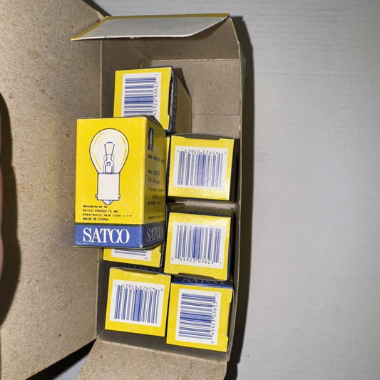 Open box containing eight Satco No. S3623 high intensity bayonet base S8 light bulbs in yellow packaging