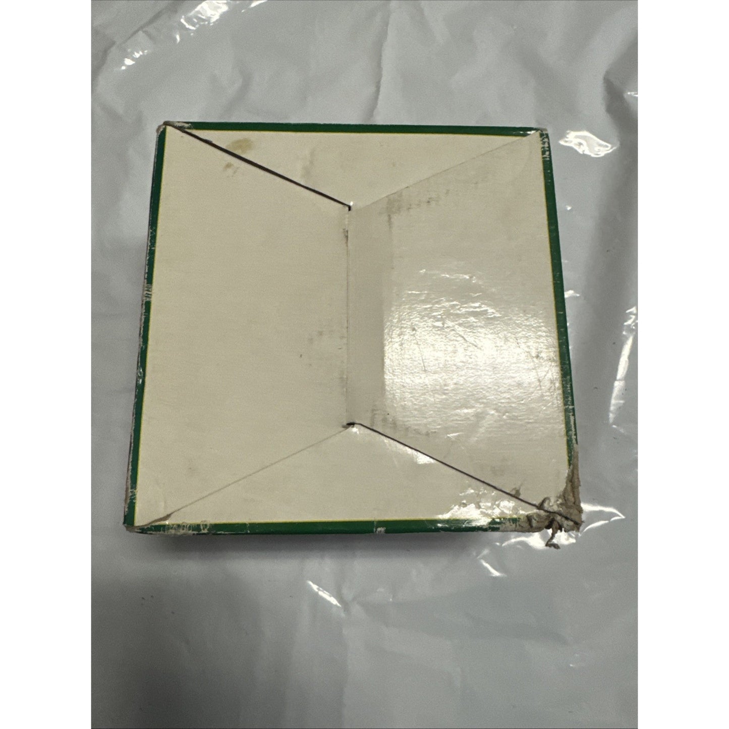 Square green and white cardboard box packaging for ND-303 low voltage halogen recessed light fixture shown from top angle