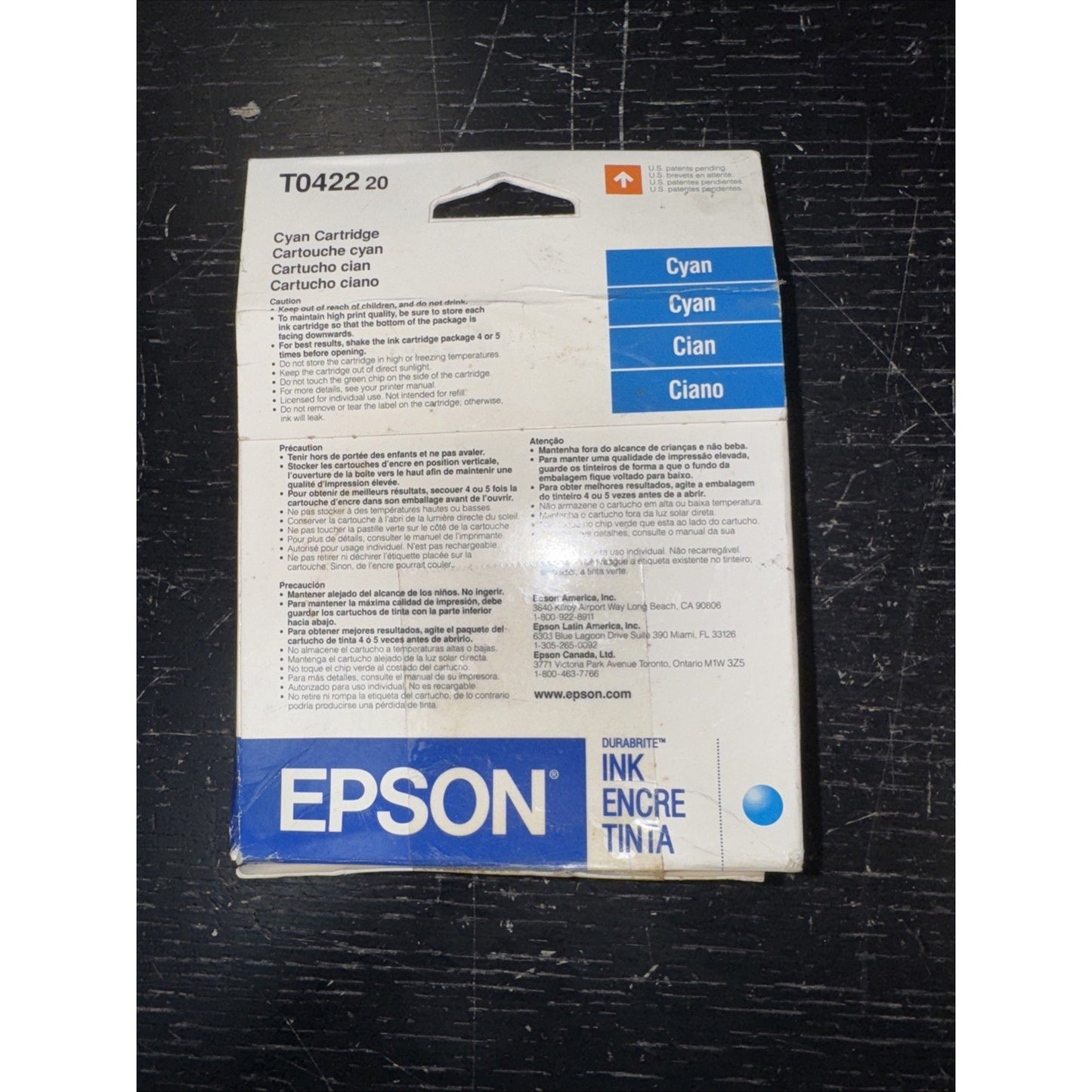 Epson T0422 20 cyan ink cartridge packaging with product details and Epson logo on white and blue box