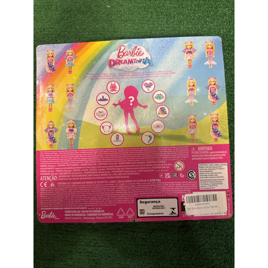 Barbie Dreamtopia Chelsea Doll Dress-up Set toy packaging showing multiple outfit options and accessories on rainbow background