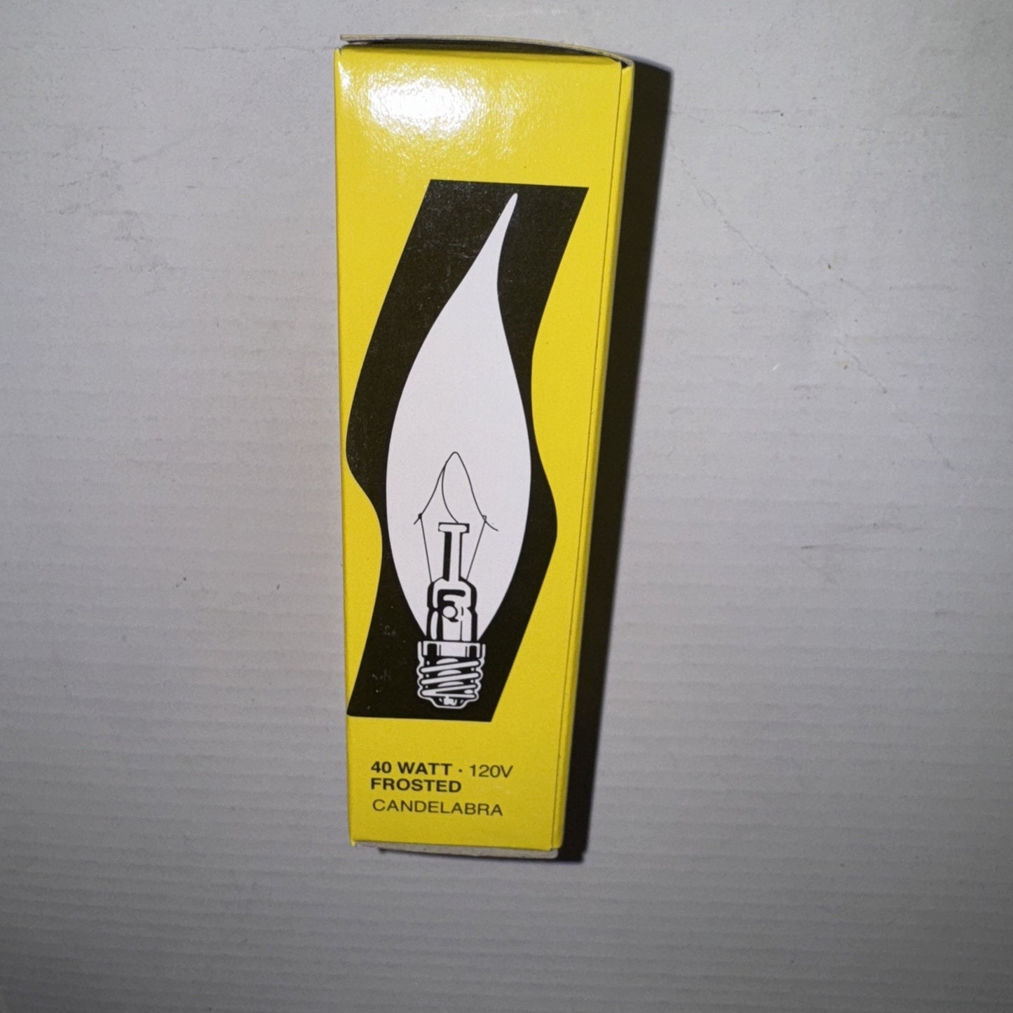 Satco S3279 frosted 40W 120V candelabra base bulb packaging with flame tip graphic on yellow box front