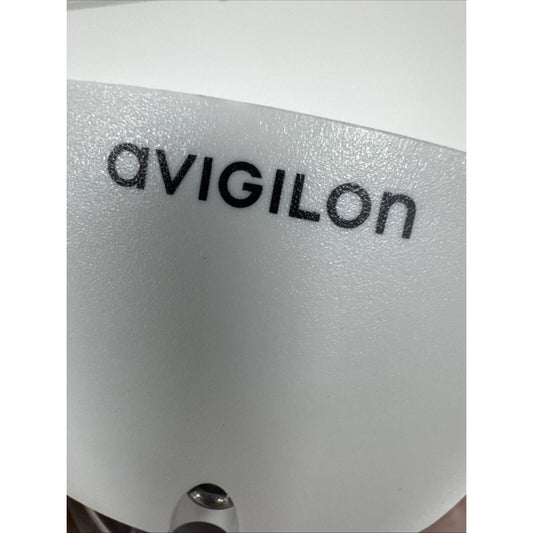 Close-up of Avigilon logo on a white surface of an indoor security dome camera housing