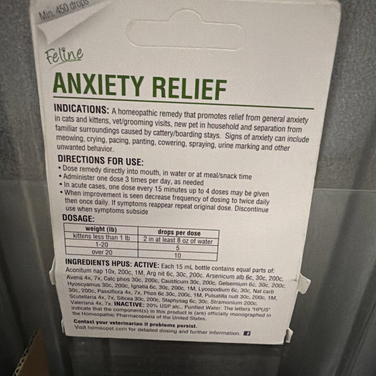 Packaging of a feline anxiety relief product showing dosage instructions, indications for use, and a table with weight-based drop recommendations for cats and kittens.