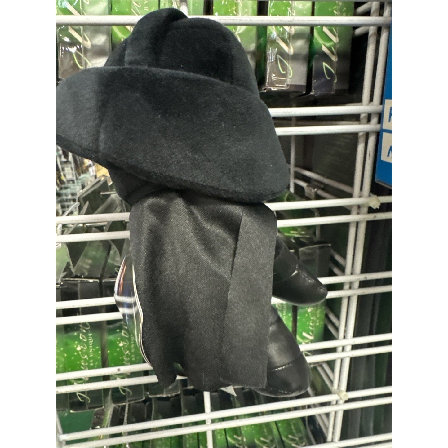 Disney Star Wars 8-inch Darth Vader plush toy by Mattel showing back with cape and helmet details on display rack