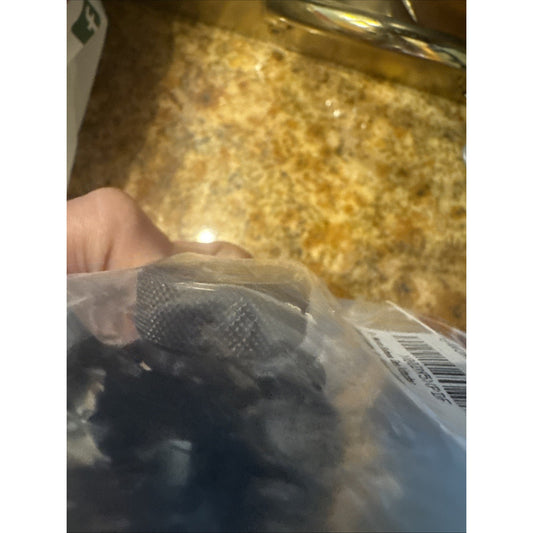 G WORKS Butane Gas Nozzle Converter magnet type adapter with rubber bushing inside clear plastic packaging held by hand