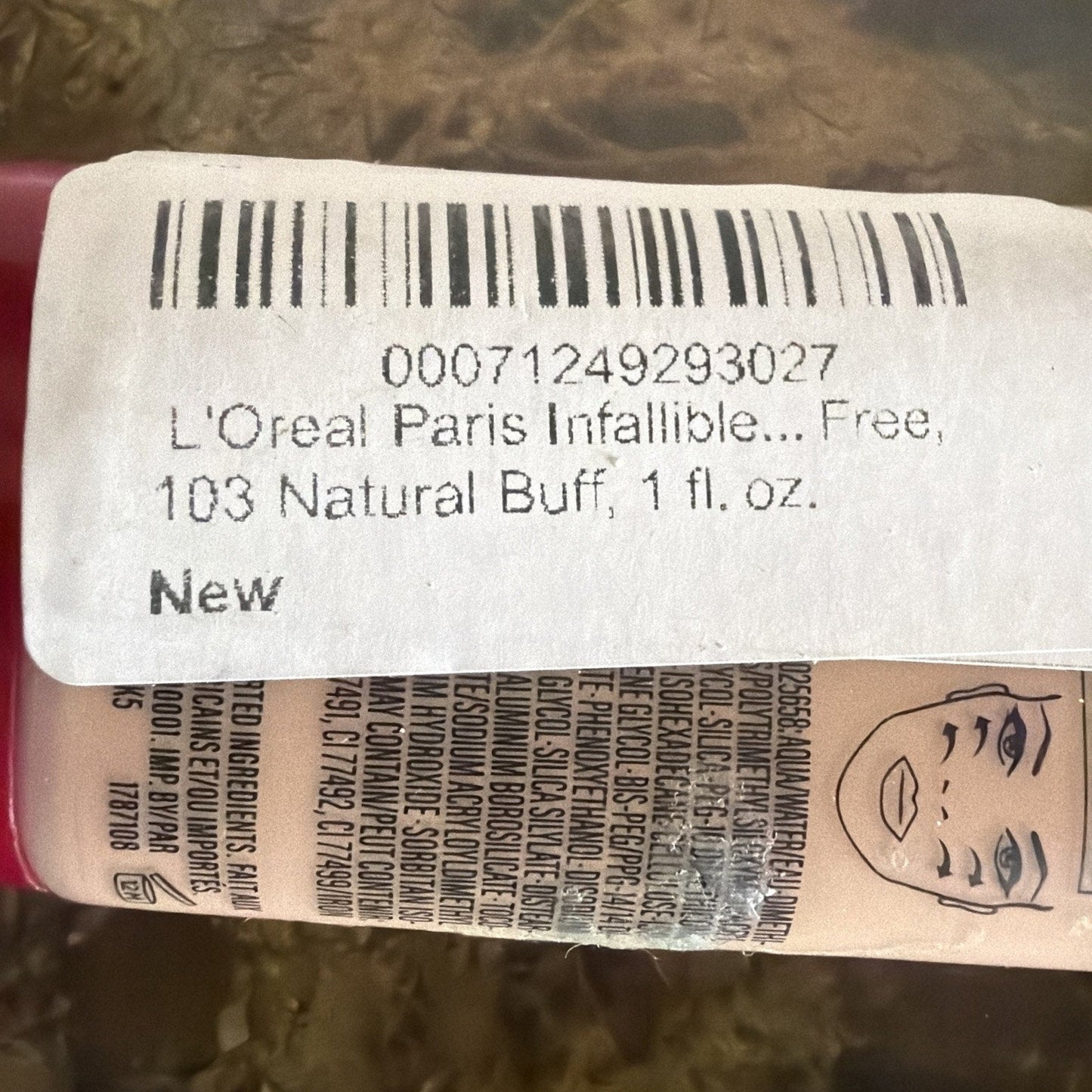 Close-up of L'Oreal Infallible Pro-Matte foundation bottle label showing shade 103 Natural Buff and 1 fl oz volume