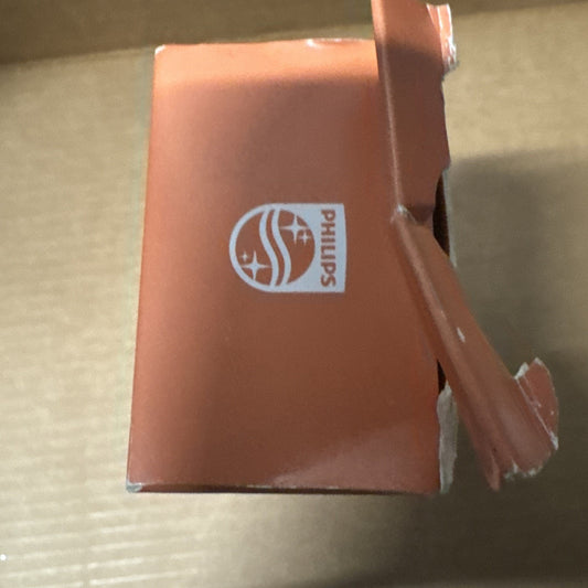 Damaged orange Philips Sonicare electric toothbrush box showing logo and torn packaging edge close-up view