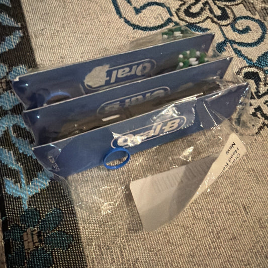 Oral B Cross Action electric toothbrush replacement heads in black color 3-pack sealed in original packaging