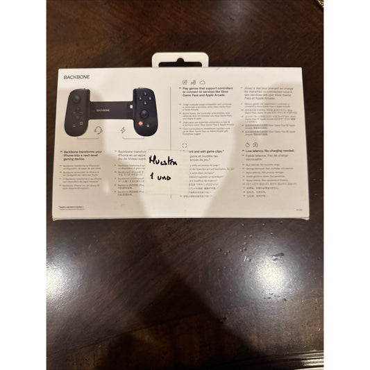 Backbone One Mobile Gaming Controller for iPhone in black shown in packaging with features and instructions on back panel