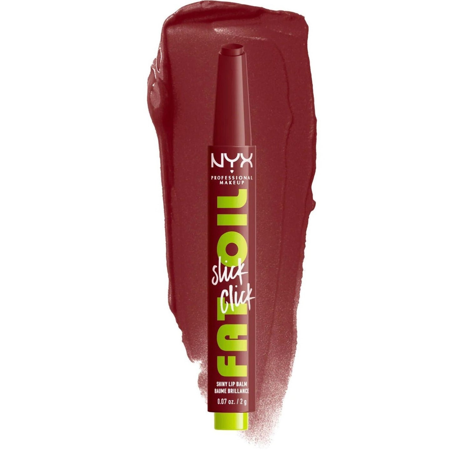 Dark red lip balm pencil with bright green and white branding text, standing upright on a matching color smudge of creamy lip product on a white background.