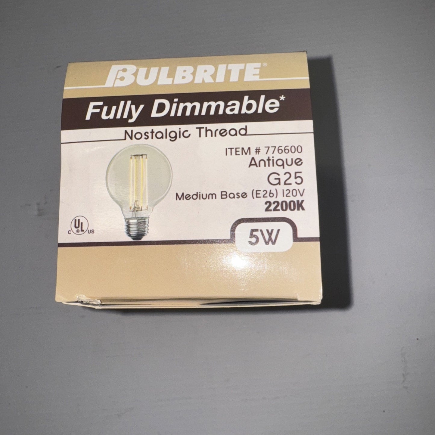 Bulbrite fully dimmable 5W LED filament antique G25 light bulb packaging with product details and specifications visible