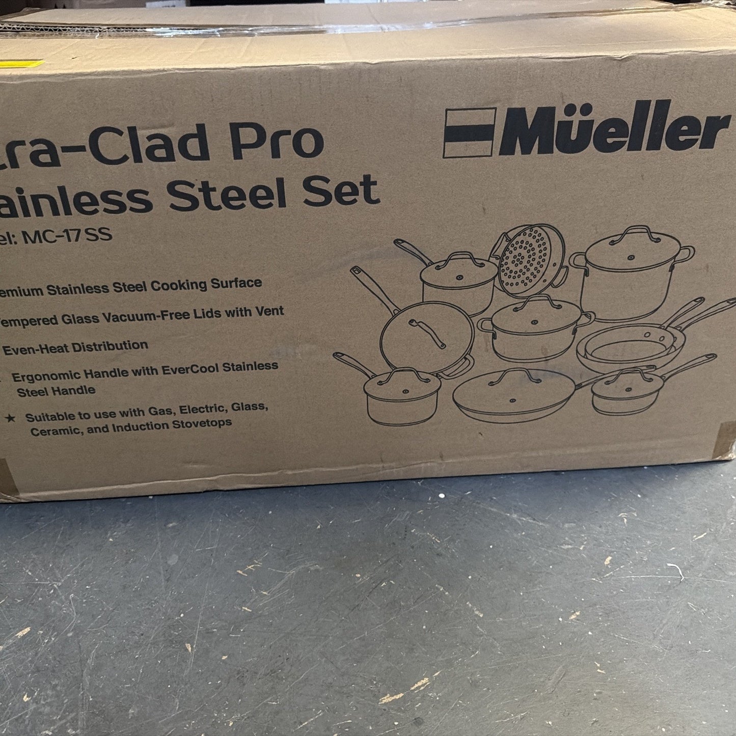 Cardboard box packaging for Mueller Ultra-Clad Pro stainless steel cookware set featuring line drawings of pots, pans, and lids with product specifications and compatibility details on the surface.