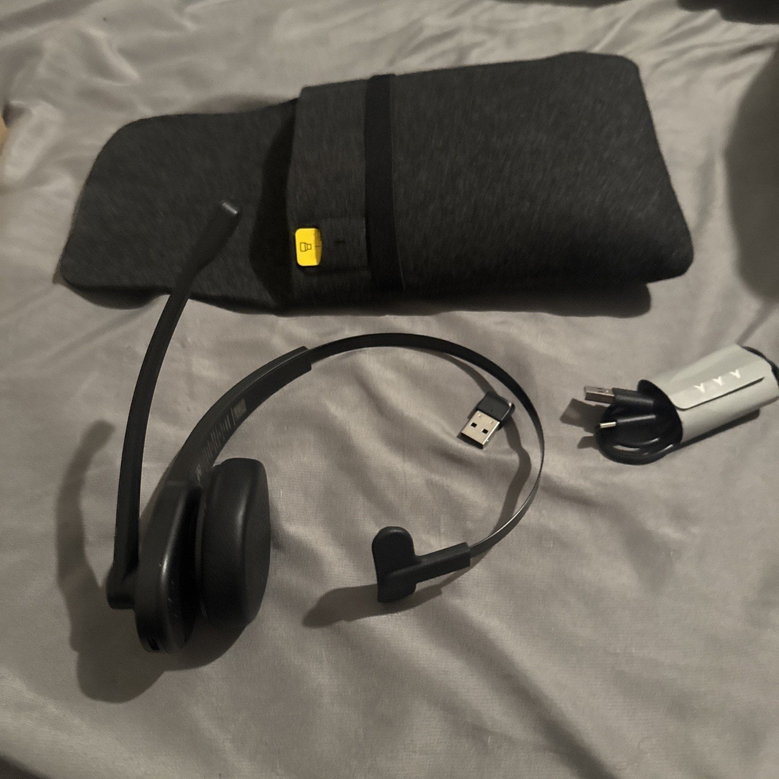 LEVN Wireless Bluetooth/USB headset with noise canceling, microphone boom, charging cable, and gray carrying pouch without box
