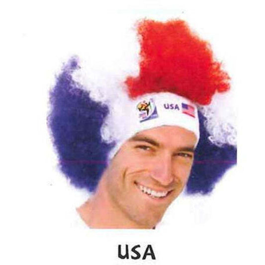Man smiling and wearing a red, white, and blue afro wig with a white headband featuring the 2010 FIFA World Cup logo, the USA flag, and "USA" text on a white background