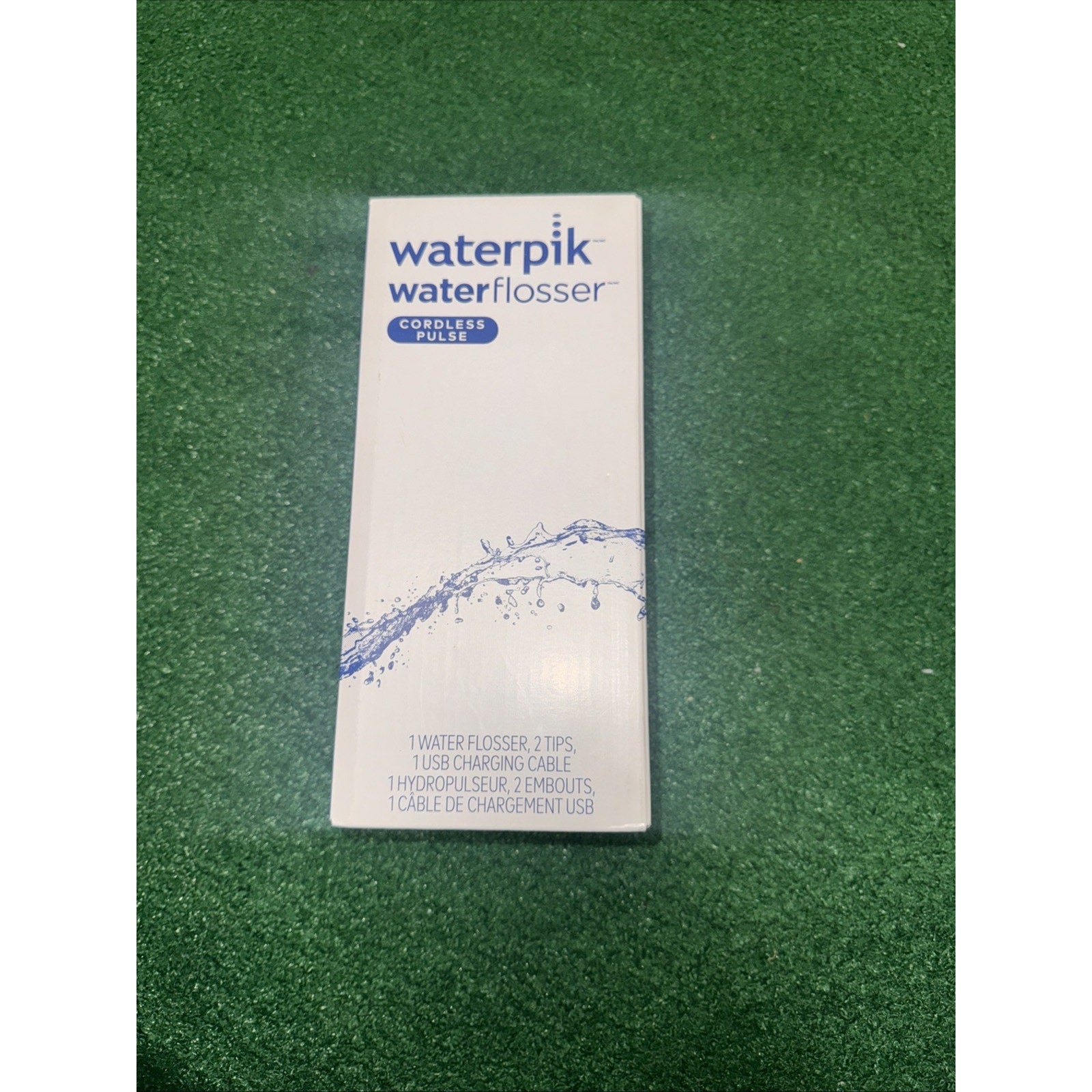Waterpik Cordless Pulse Portable Water Flosser WF20CD013 in white with splash graphic on packaging box front