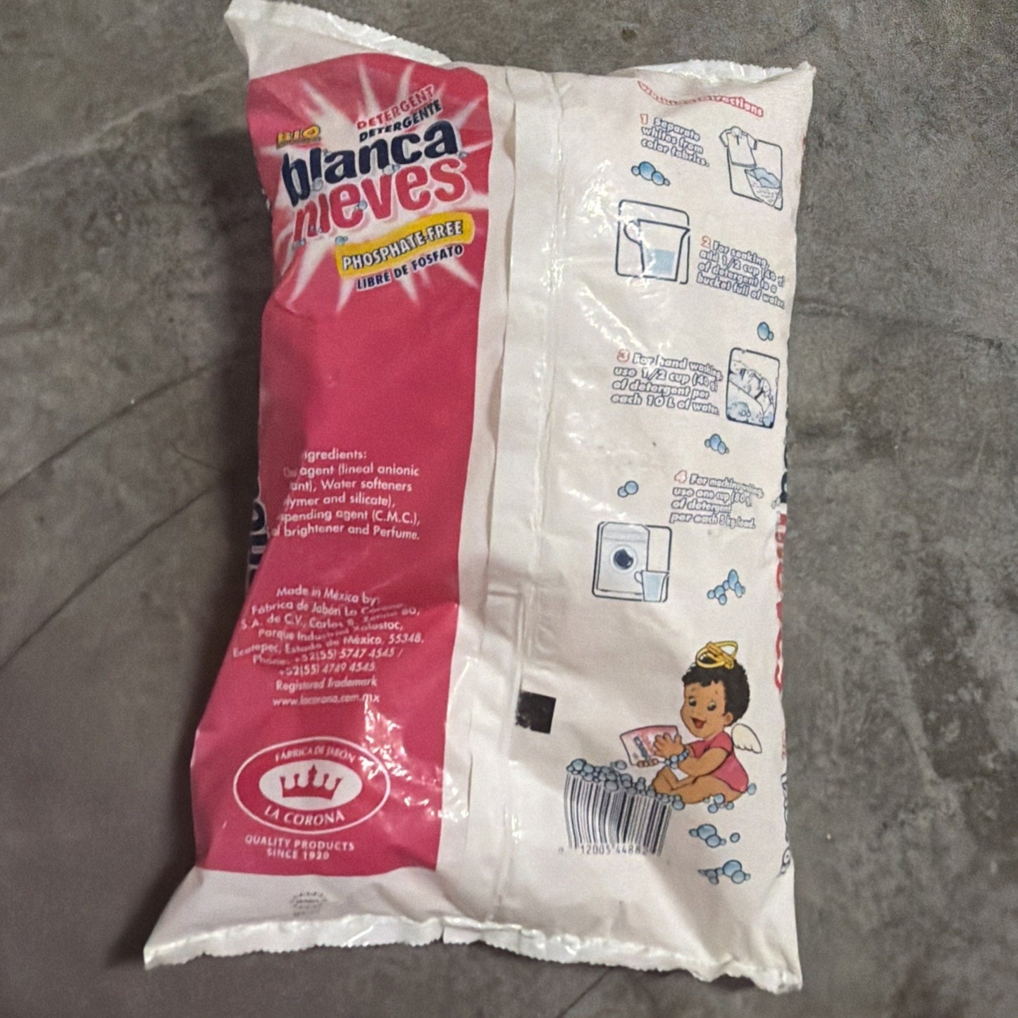Plastic bag of Blanca Nieves phosphate-free powdered detergent with pink and white packaging, featuring usage instructions and a cartoon child washing clothes with bubbles.