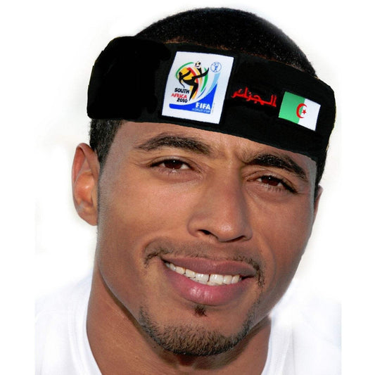 Man wearing a black headband featuring the 2010 FIFA World Cup South Africa logo, Arabic script, and the Algerian flag, smiling against a white background.