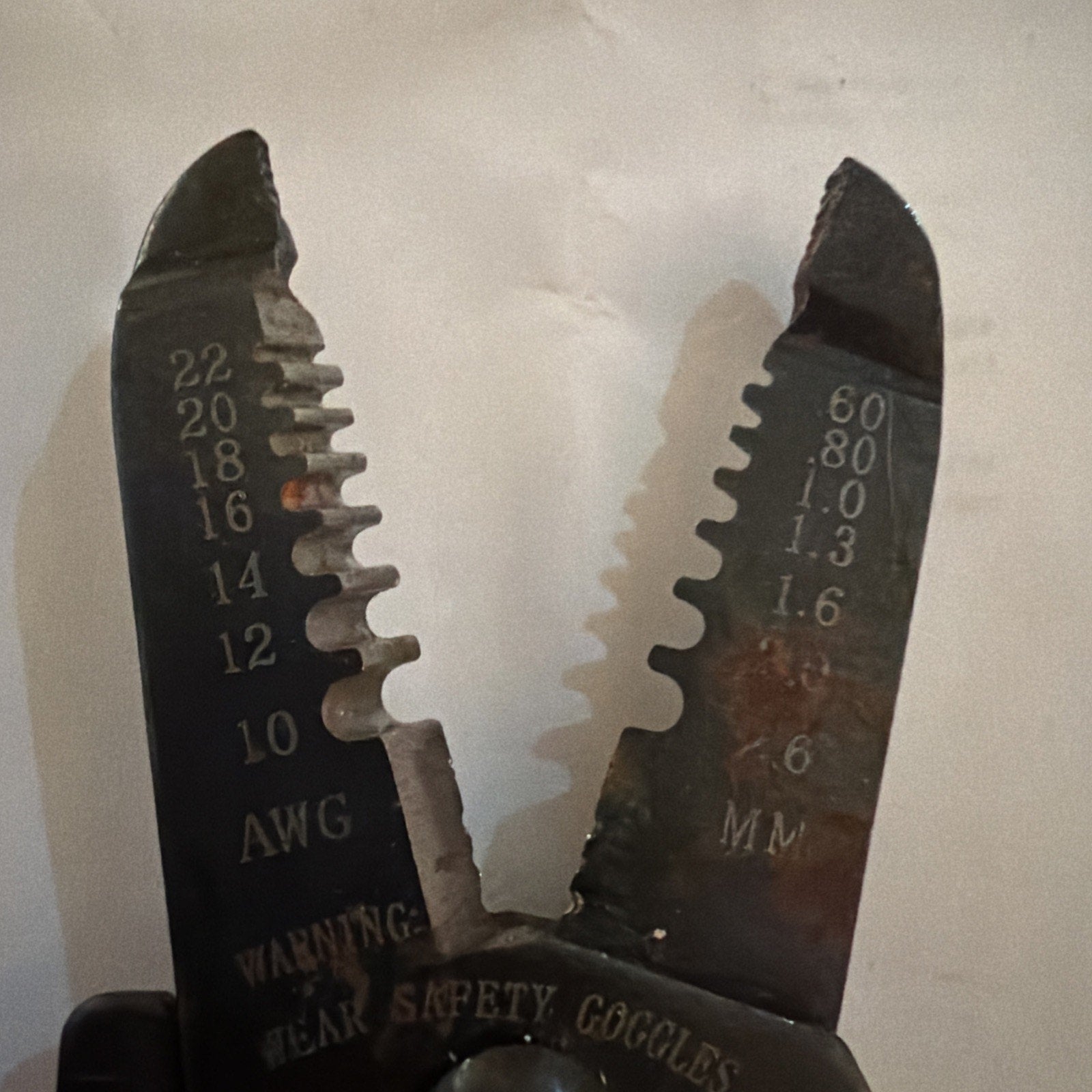 Close-up of Jonard JIC-1022 wire stripper cutter jaws showing wire gauge markings from 10 to 22 AWG