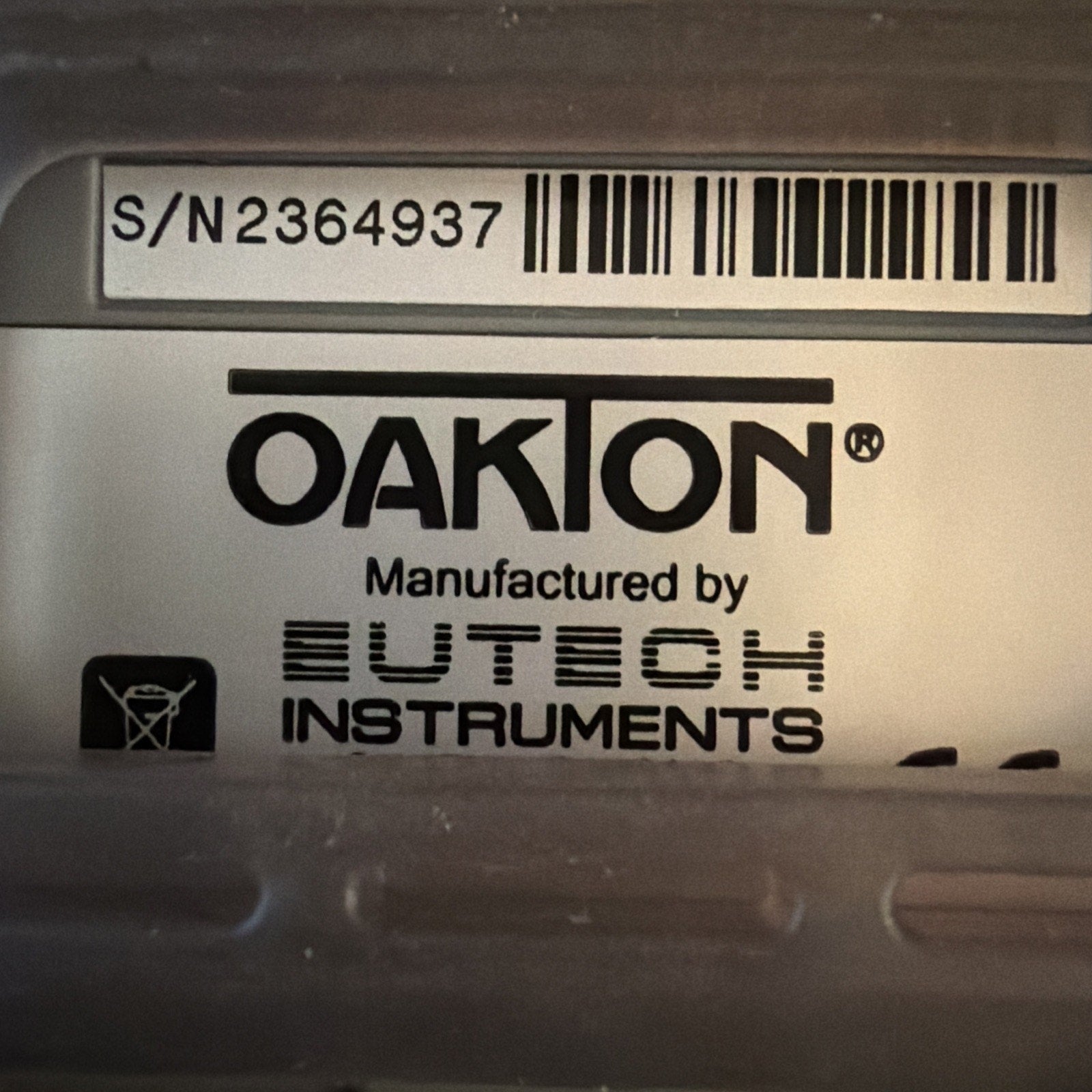 Serial number label and manufacturer logo on Oakton SALT 6+ Handheld Salinity Meter by Eutech Instruments