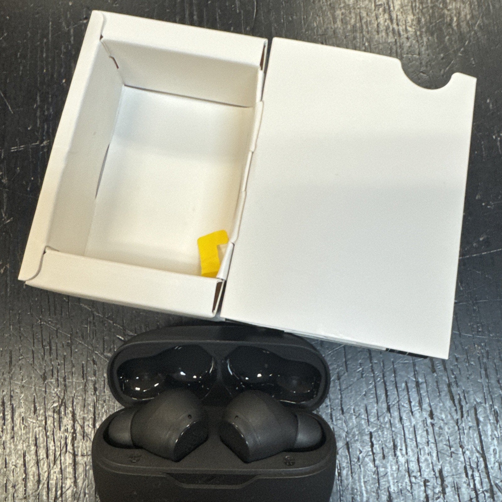 JBL by Harman Vibe Beam True Wireless Bluetooth Earbuds in black with open charging case and white packaging box