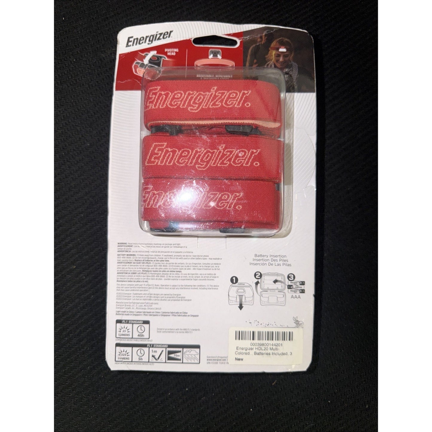 Retail packaging showing three red Energizer-branded battery holders with visible instructions, safety information, and a barcode on a white backing card.