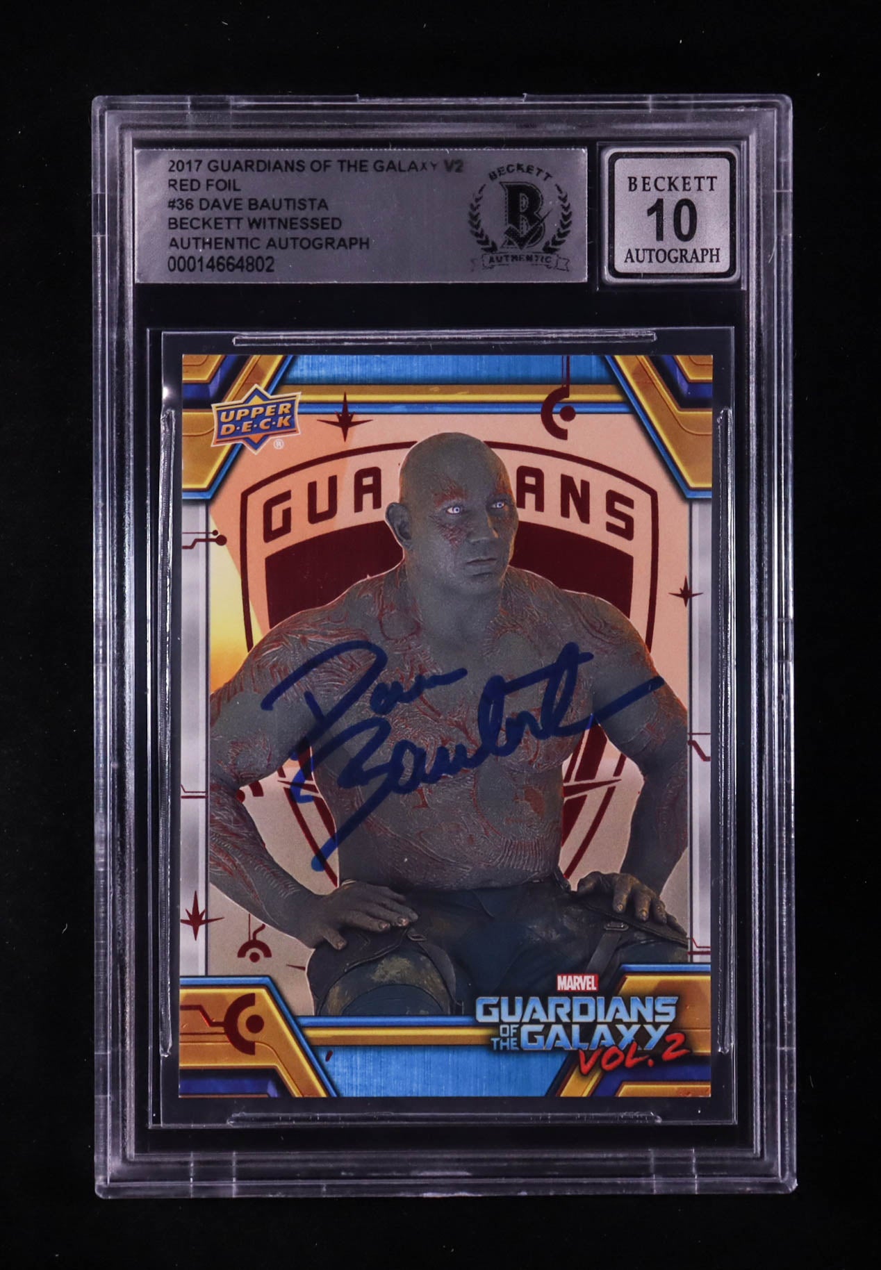 Protective graded case containing a Guardians of the Galaxy Vol. 2 trading card featuring a red-foil image of a character with a blue autograph signed across the front.
