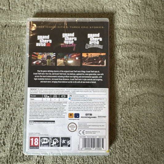 Back of NEW PAL GTA Grand Theft Auto The Trilogy Definitive Edition Nintendo Switch game case with game descriptions and ratings