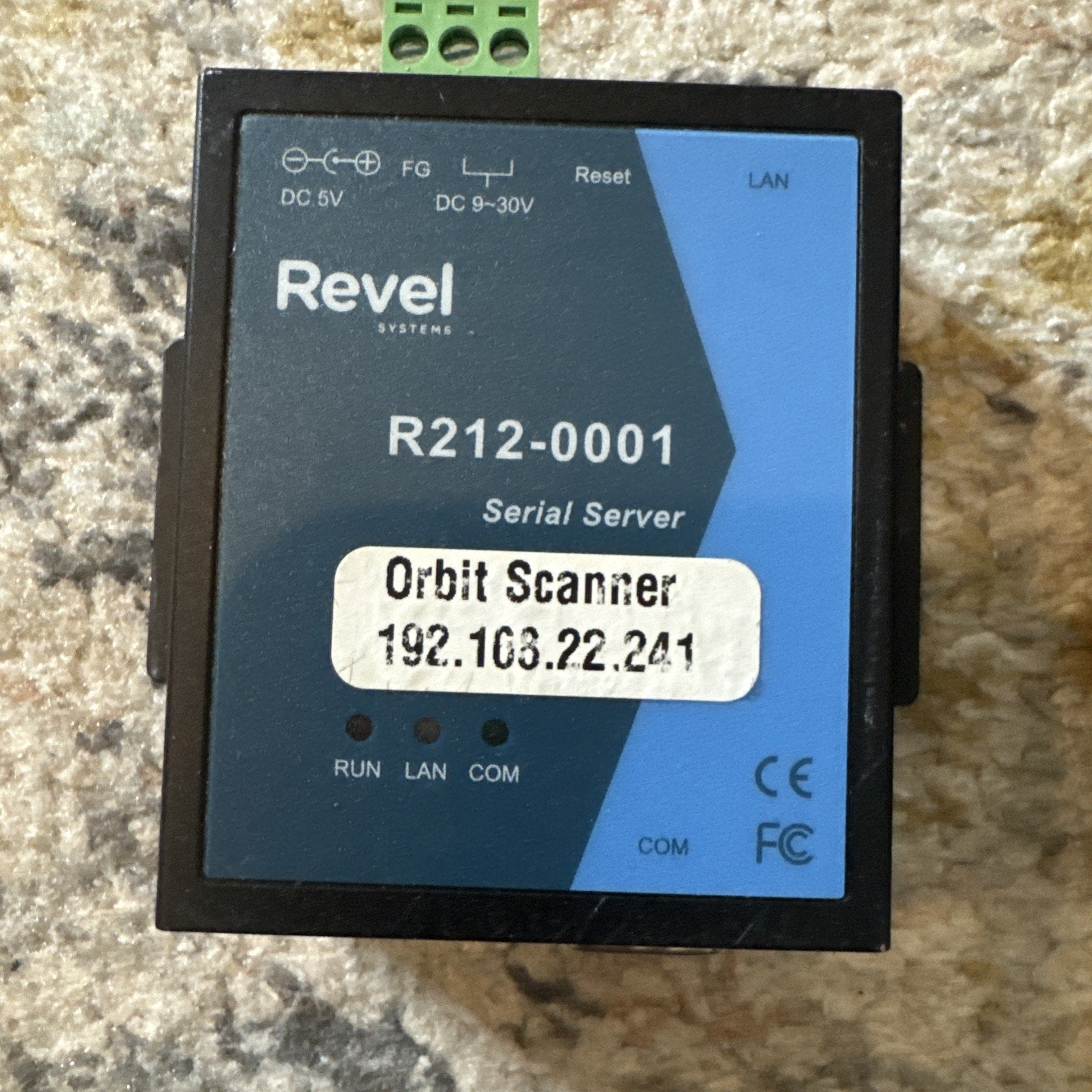 Revel R212-0001 Serial Server Orbit Scanner device with LAN port and labeled IP address on blue and black casing