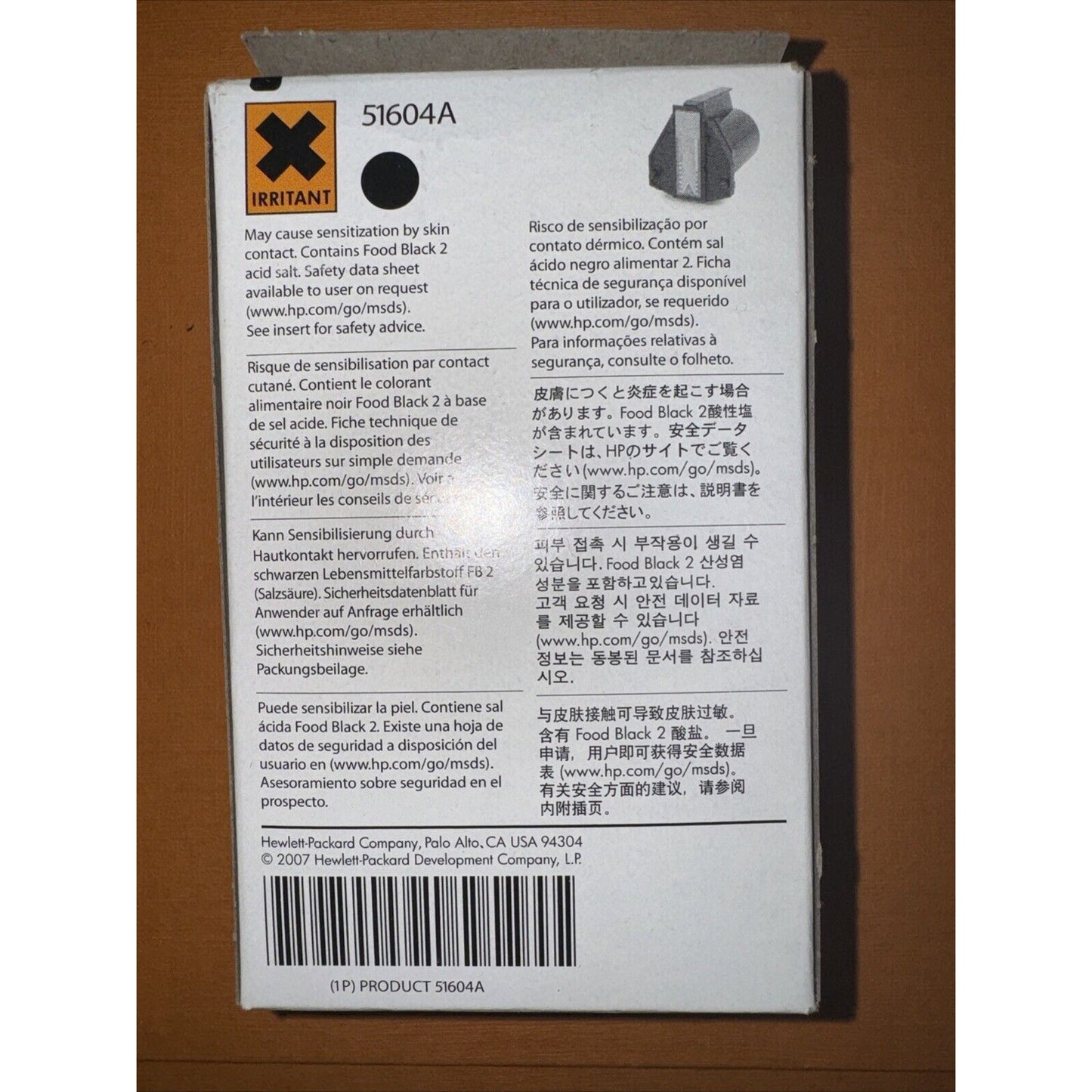 Back of HP 51604A black ink cartridge box with safety warnings in multiple languages and barcode