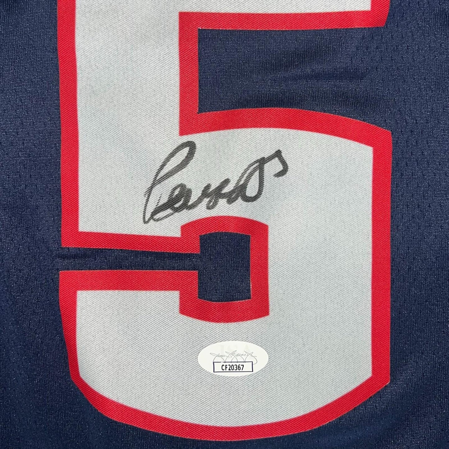 Close-up of Paige Bueckers signed number 5 on navy blue UConn Huskies Nike authentic jersey with JSA hologram sticker