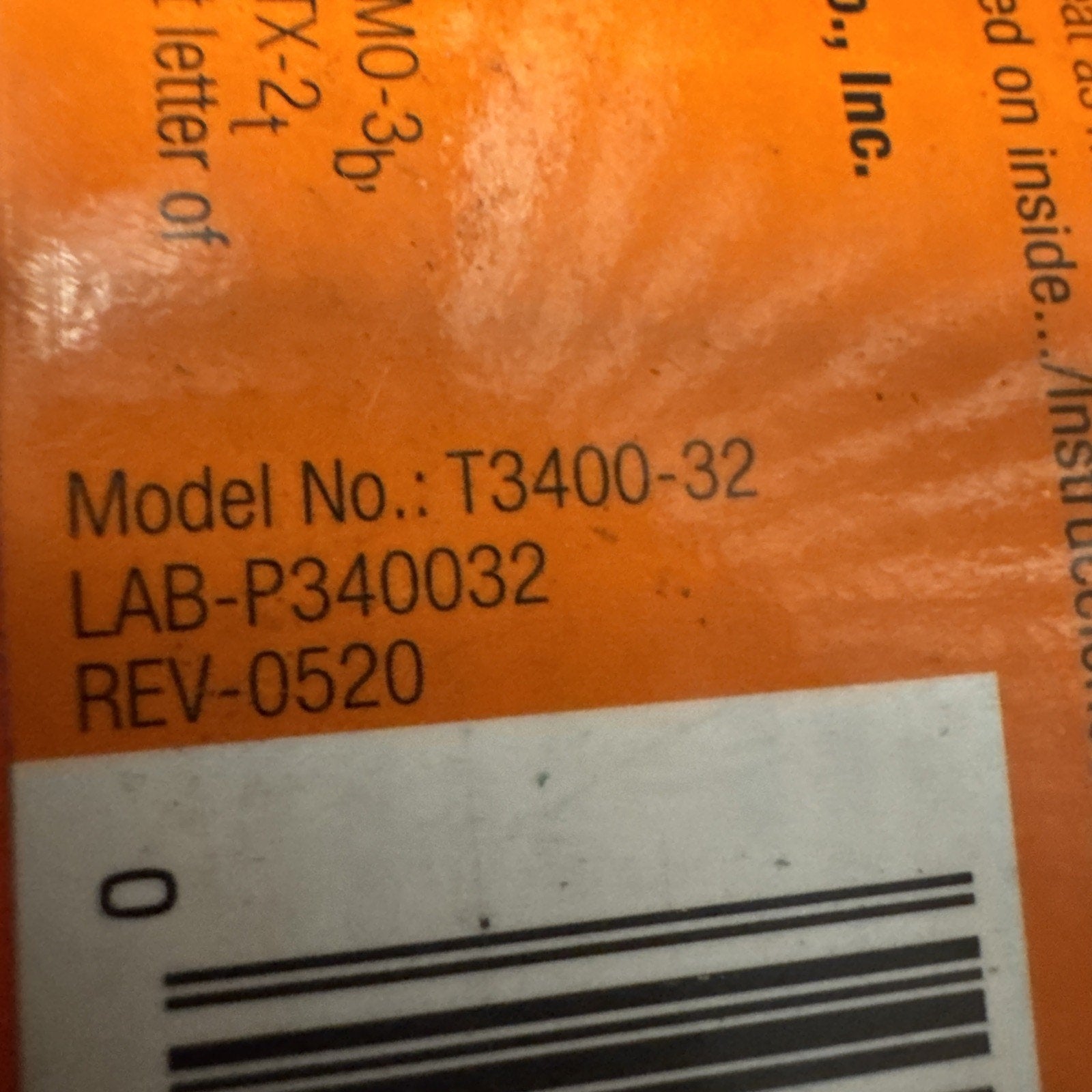 Close-up of Terro T3400-32 Home Pest Control orange label showing model number and barcode details