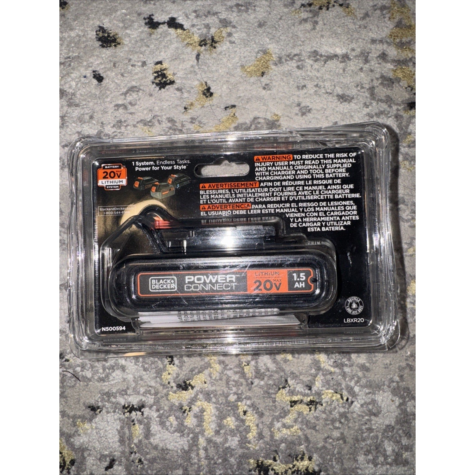 BLACK+DECKER LBXR2020-OPE 20V MAX 1.5Ah lithium battery in retail sealed plastic packaging on textured surface