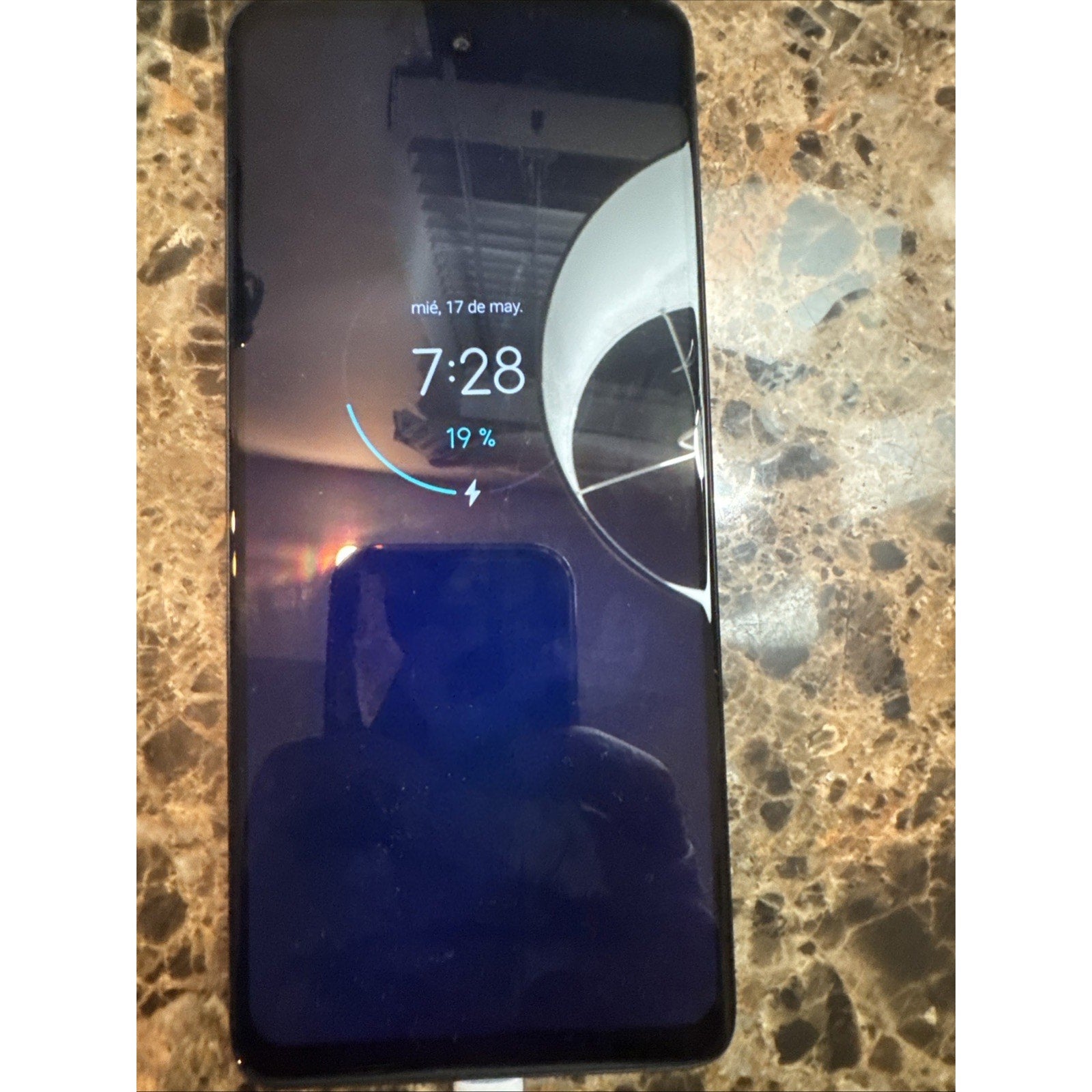 Open Box Motorola Moto Edge Plus 2022 smartphone in Cosmos Blue showing lock screen with time and battery charging status