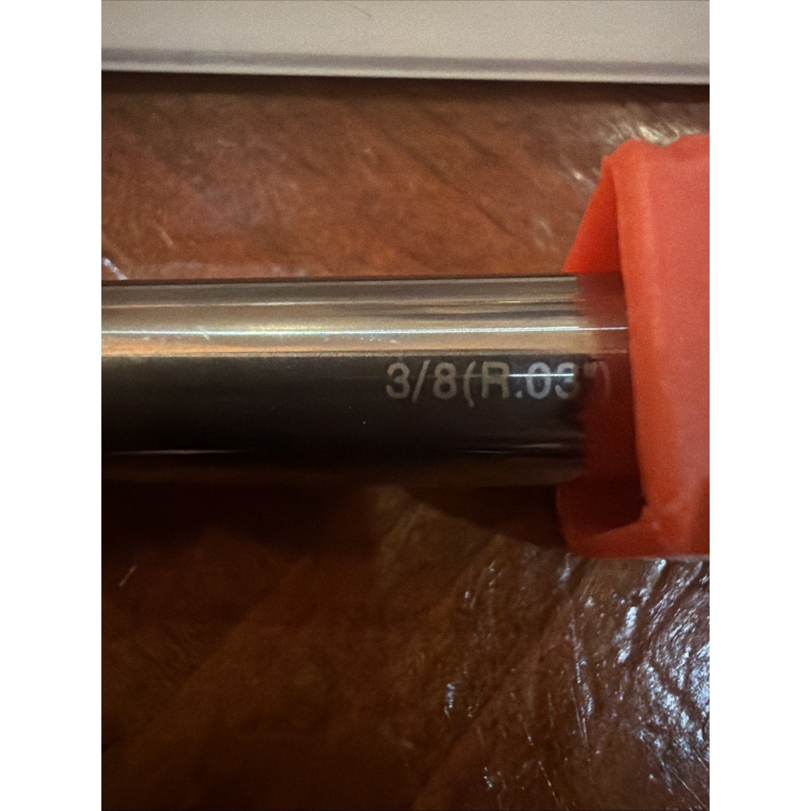 Close-up view of a metal tool shaft with the engraved measurement 
