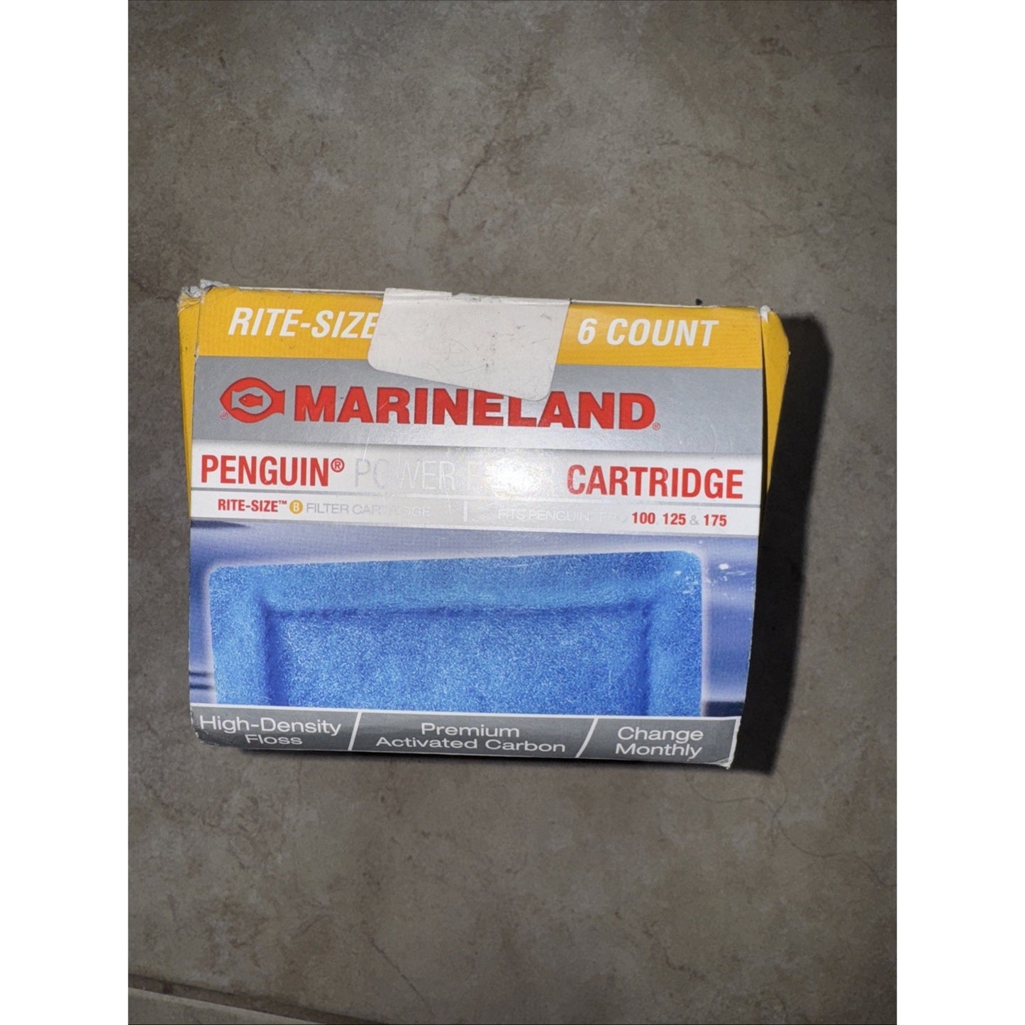 Marineland Penguin Power Cartridge packaging showing a 6-count box with blue high-density filter floss containing premium activated carbon, designed for monthly replacement.