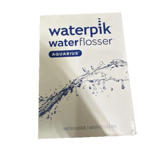 Front view of Waterpik Water Flosser Aquarius packaging featuring the brand name, a blue water splash graphic, and text indicating the inclusion of one flosser and seven tips on a white background.