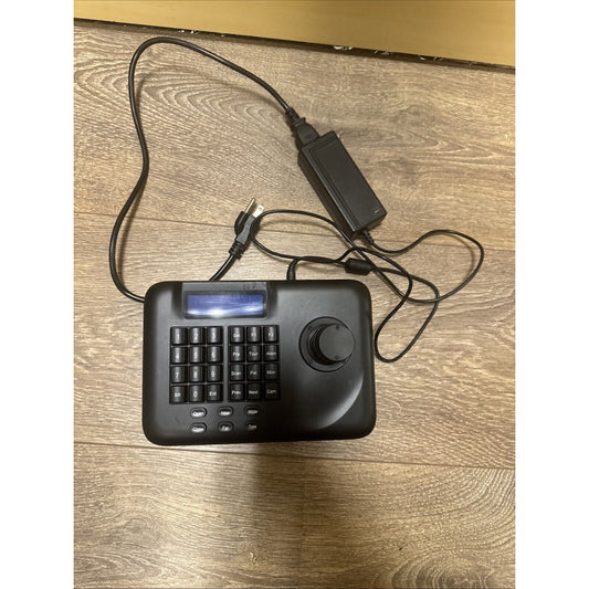 Wirepath Surveillance PTZ 3D Controller WPS-ACC-PTZ-CTRL with joystick and keypad on wood surface with power adapter and cord