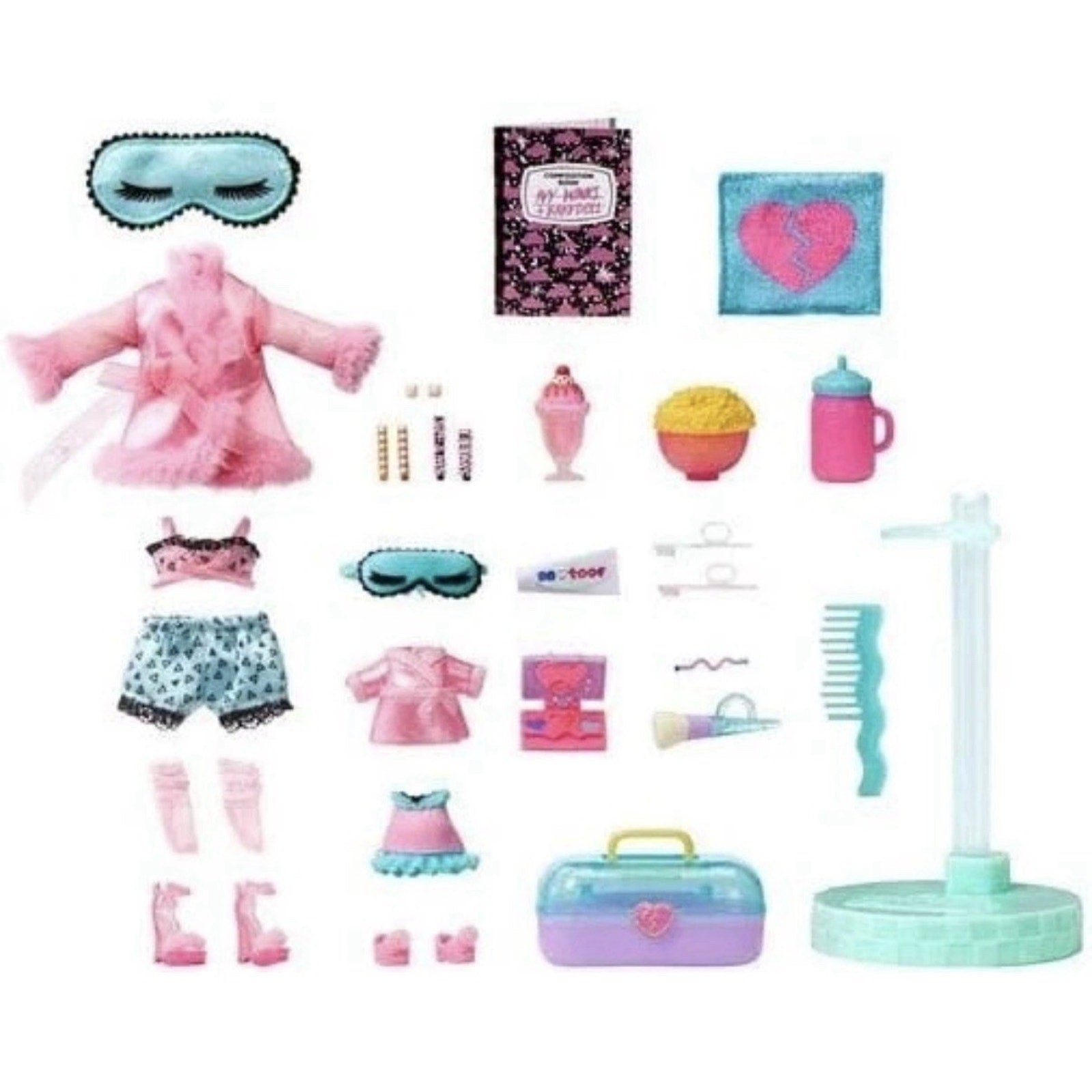 Assorted small doll accessories including a pink robe, two sleep masks, patterned shorts and top, miniature snacks, bottles, a comb, a stand, and a pastel-colored carrying case with a heart emblem.