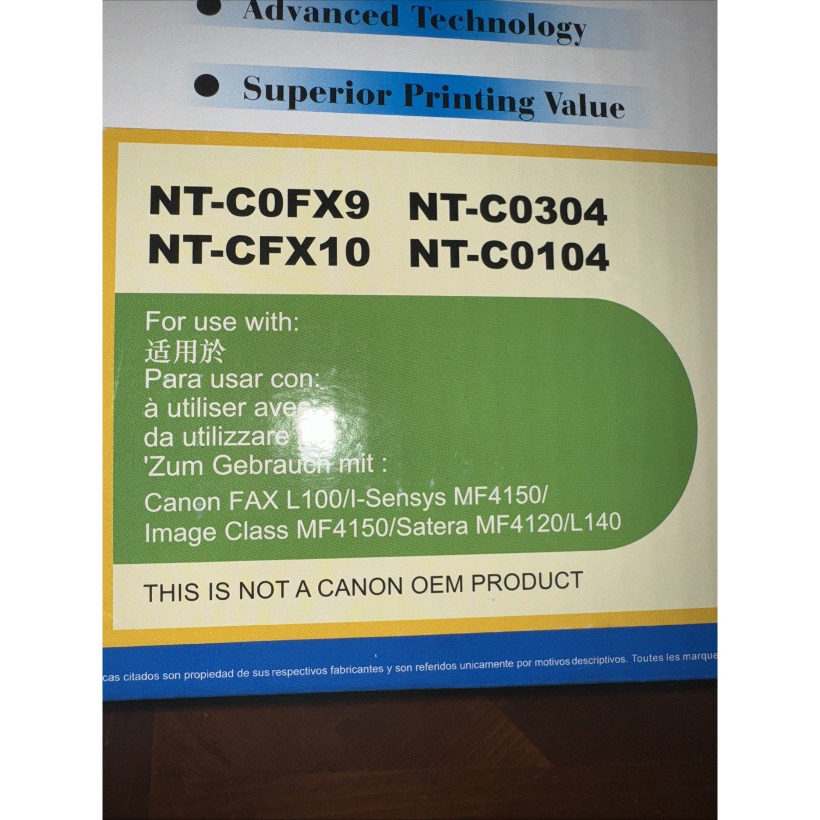 Close-up of printer cartridge packaging label detailing compatible Canon fax and Image Class models with model numbers and multilingual usage information on white background