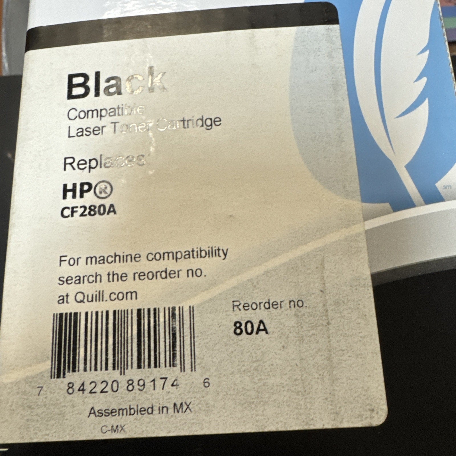 White label on black toner cartridge packaging indicating compatibility with HP CF280A model, barcode printed below and reorder number 80A, assembled in Mexico.