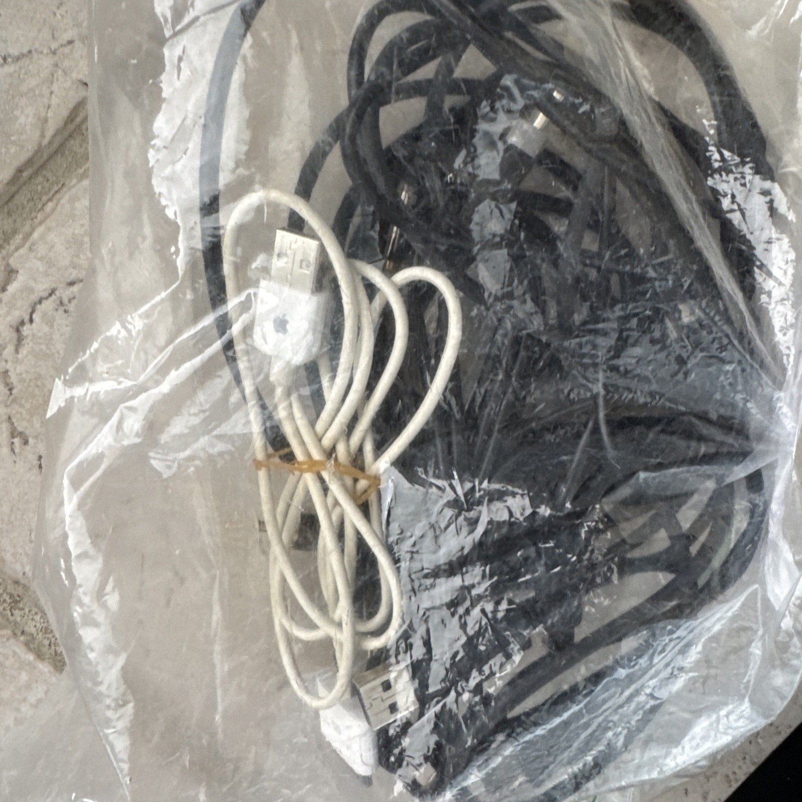 Alarm.com 8CH Commercial Streaming Video Recorder cables including white and black USB cords in clear plastic bag
