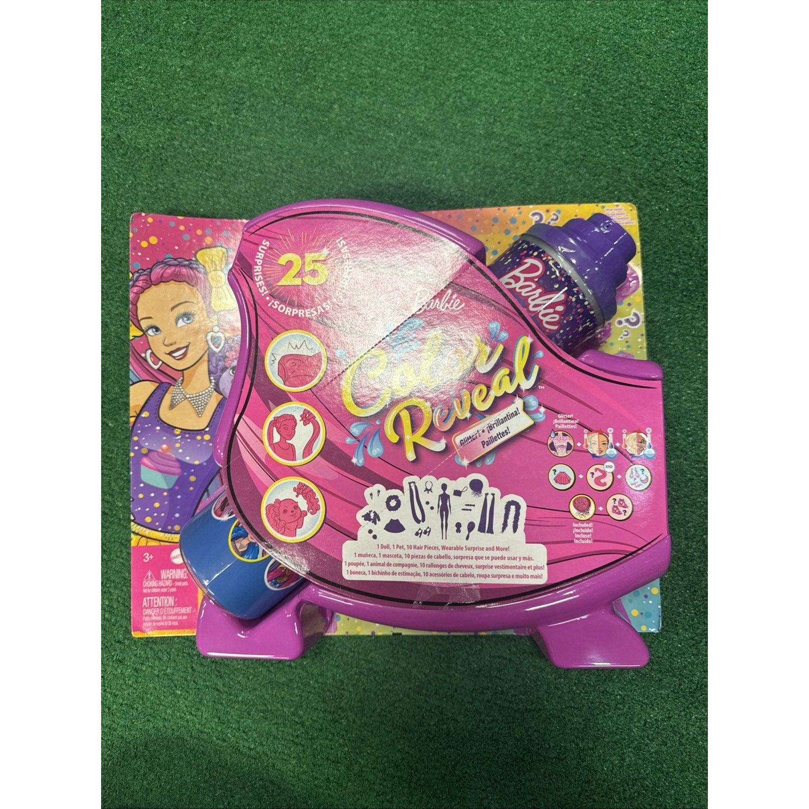 Barbie Color Reveal Glitter Hair Swaps Doll packaging in glittery pink with 25 surprise features and accessories