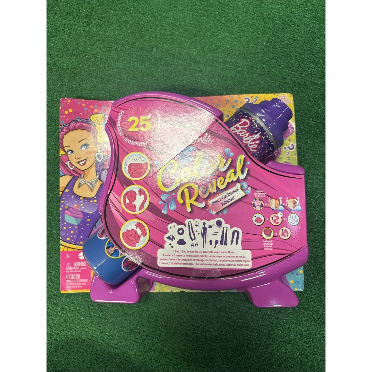Barbie Color Reveal Glitter Hair Swaps Doll packaging in glittery pink with 25 surprise features and accessories