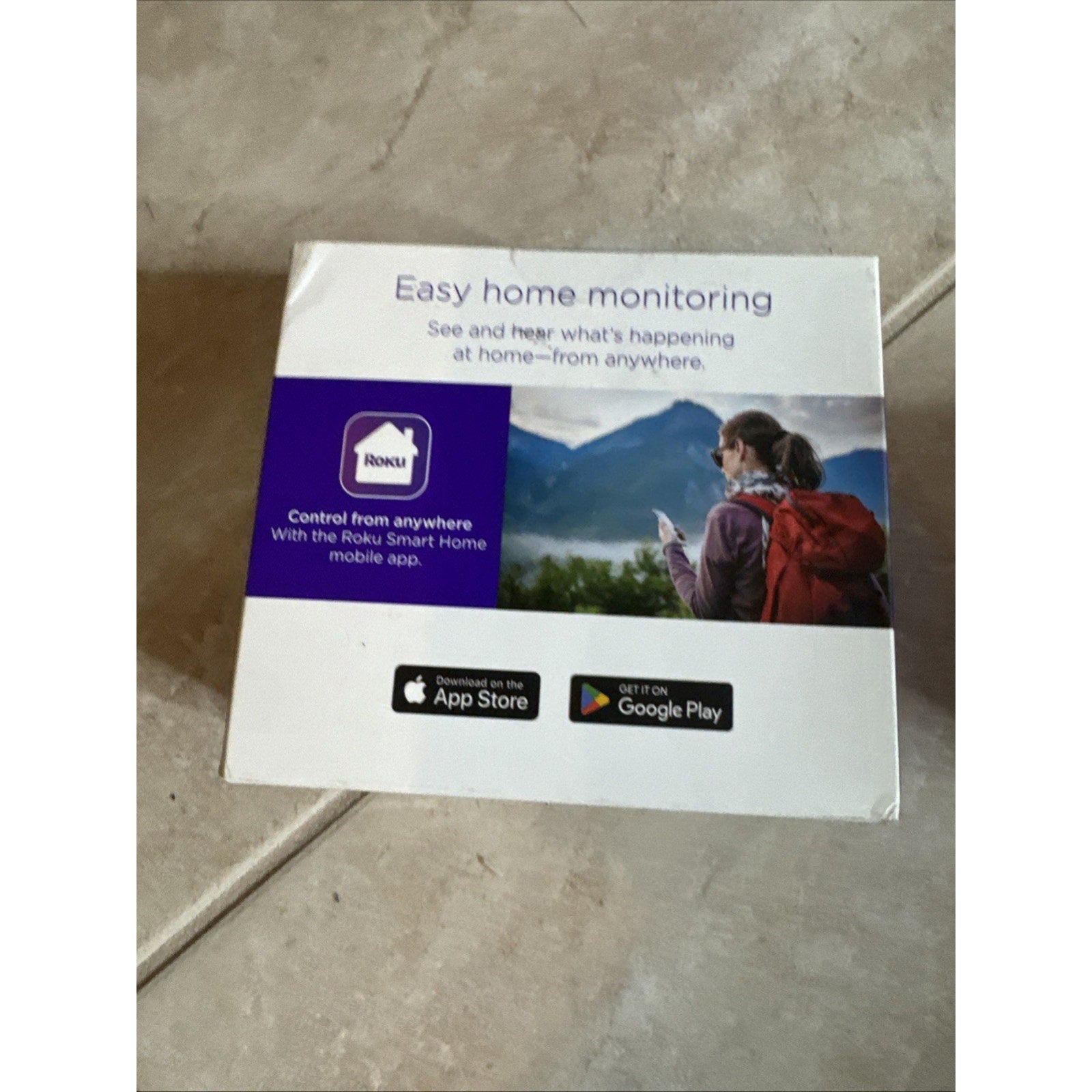 Roku Indoor Camera SE box showing easy home monitoring with Roku Smart Home app and available on App Store and Google Play