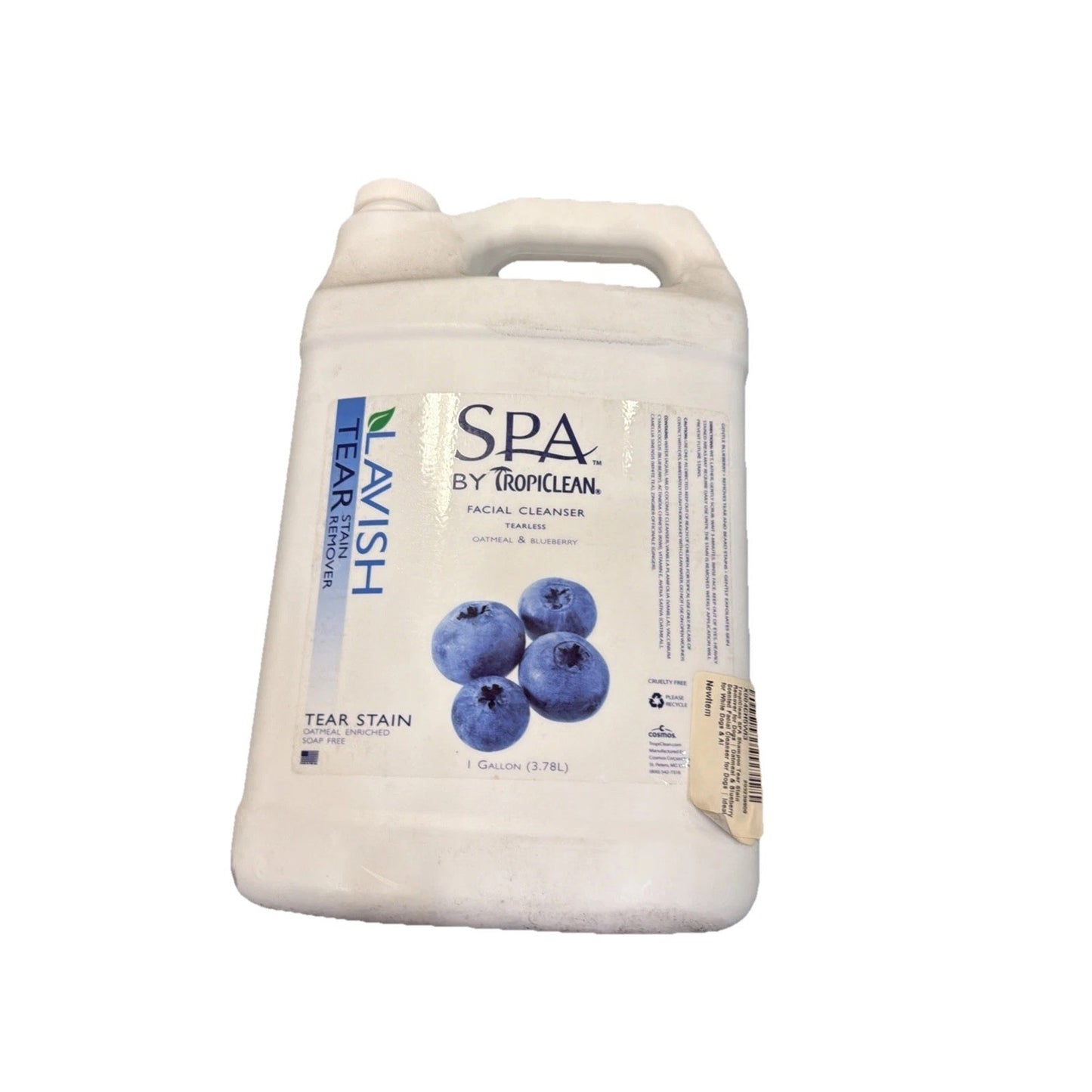 White plastic gallon container of Lavish Tear Stain remover featuring a label with blueberries and Spa by Tropiclean branding on a plain white background.