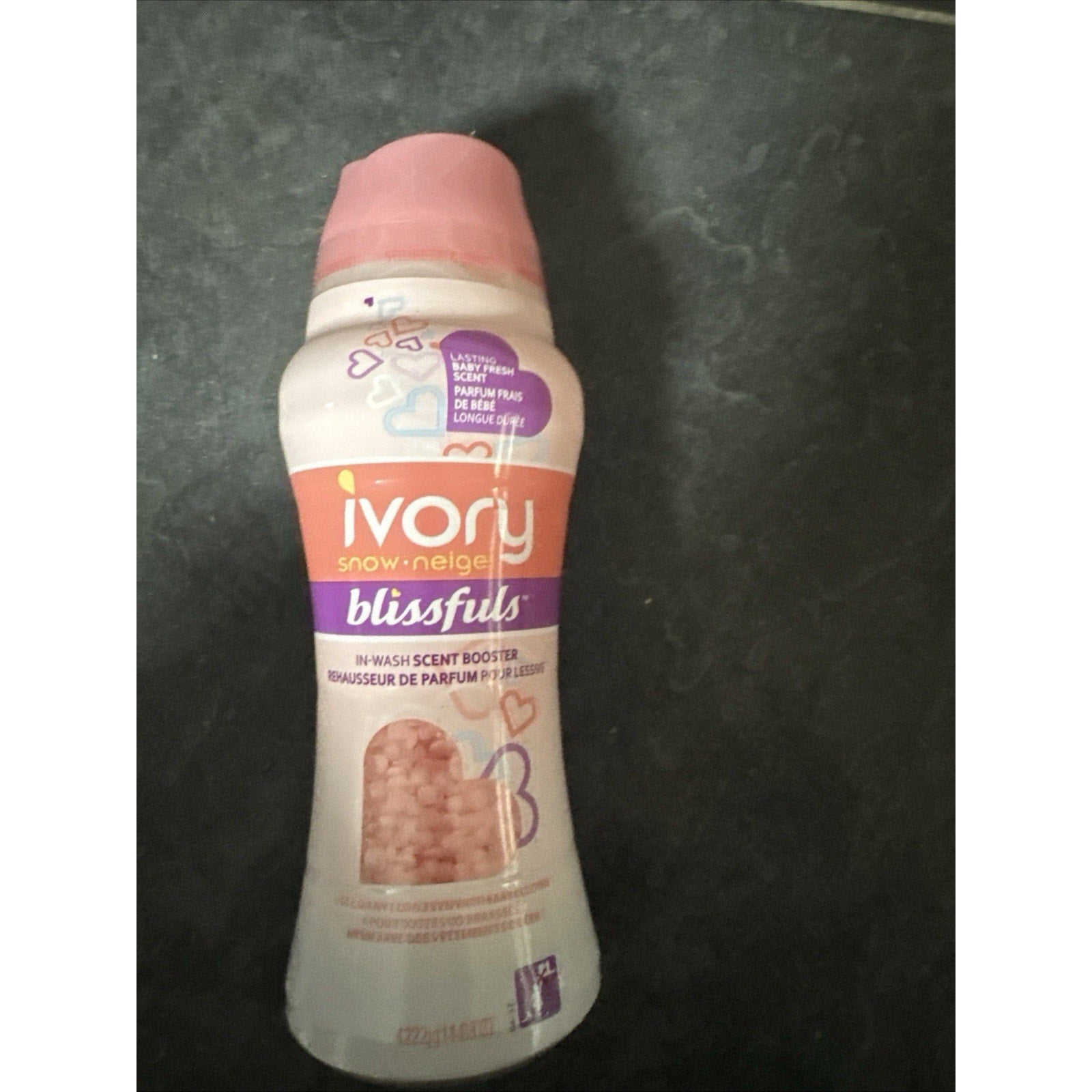 Ivory Snow Blissfuls in-wash scent booster beads bottle in Baby Fresh scent with pink granules and purple label