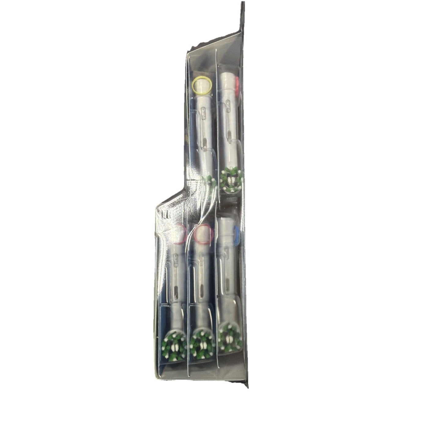 Side view of four toothbrushes in clear plastic packaging, each with differently colored rings near the bristles, arranged vertically.